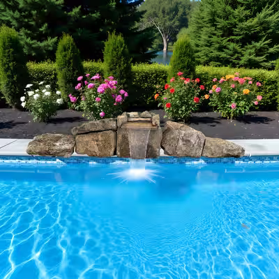 Natural stone waterfall system kit 1015 cascading into a swimming pool